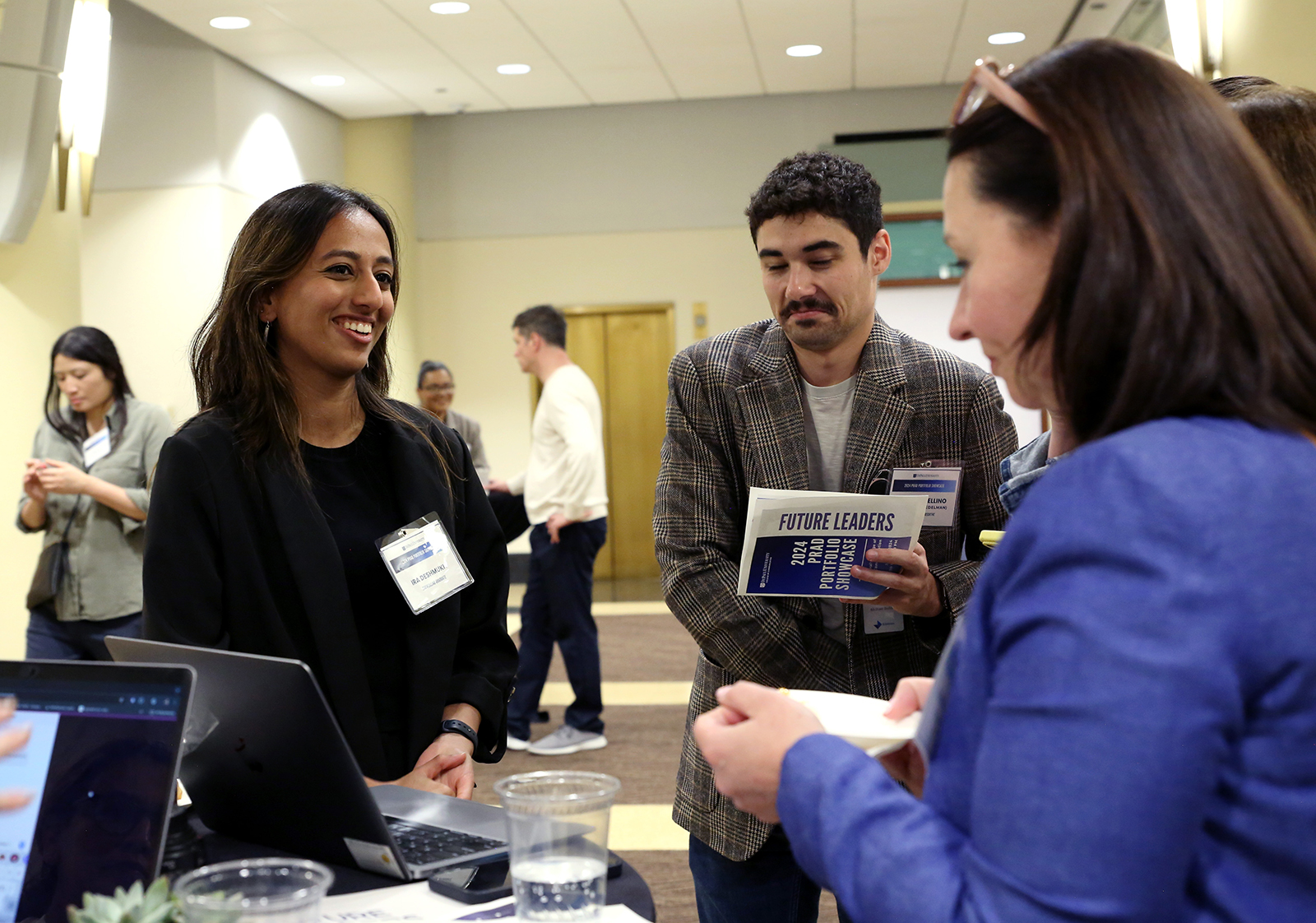 Attendees speaking to each other at an event