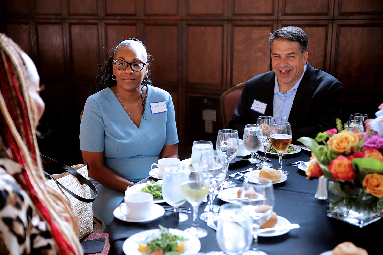 Attendees sitting at table at an event